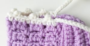Close-up of crochet baby booties