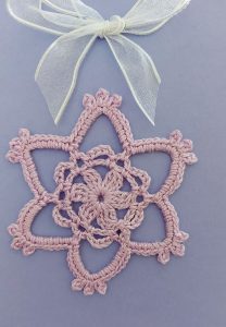 card with crochet flower decoration
