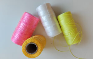 Coloured cones of twine to use use for crochet