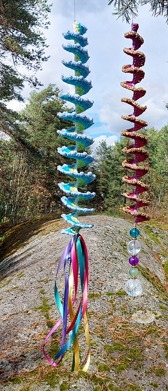 crochet wind spinners decorated with silk ribbon tassels and a bead string